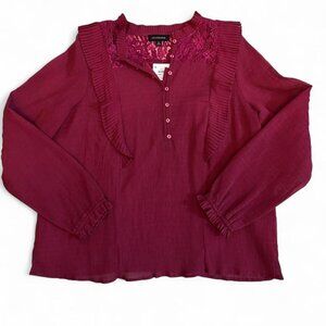 Calligraphie burgundy blouse with lace details and ruffles.